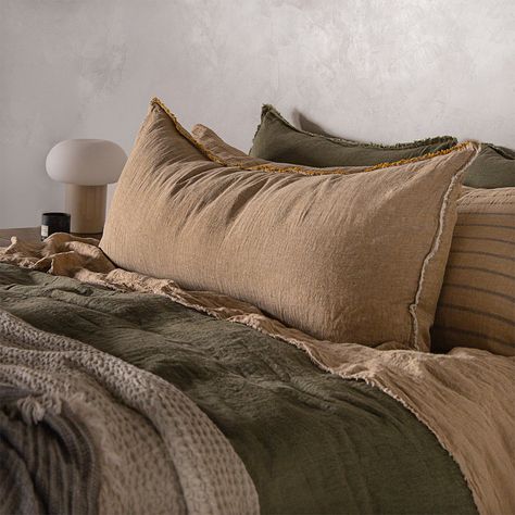 Our versatile Flocca Linen Body Pillow is an elegant combination of luxury and practicality that will bring comfort and style to your bedroom or living space. The Flocca Linen Body Pillow in Brun is a soft toffee melange.Our extra-long linen body pillow case is finished with a double stitch hem, beautiful hand 'tufted' edges and secured with a hidden closure, making it a luxurious body cushion for both living and bedroom.The Flocca Linen Body Pillow works beautifully alongside our classic Flocca Olive And Burnt Orange Bedroom, Earthy Bed Set, Making Bed With Body Pillow, Long Pillow On Bed, Warm Earthy Bedroom, Rust Bedroom Ideas, Cozy Romantic Bedroom Ideas, Earthy Modern Bedroom, Soft Toffee