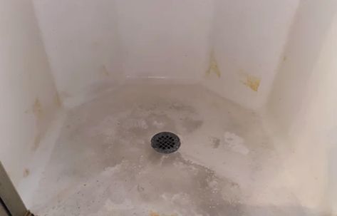 How to Remove Stains from the Shower Floor - The Indoor Haven Stained Shower Pan, How To Clean Textured Shower Floor, Shower Stain Remover, How To Clean Plastic Shower Floor, Clean Plastic Shower Floor, Shower Floor Cleaning Hacks, Cleaning Fiberglass Shower Stall, How To Clean A Fiberglass Shower Pan, Stained Shower Floor