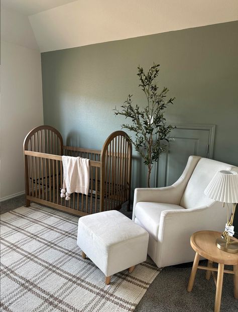 Dark Furniture Nursery Boy, Mixed Woods Nursery, Nursery Dark Carpet, Sage And Brown Nursery, Clean Nursery Ideas, Magnolia Home Nursery, Nursery With Walnut Crib, Green And Natural Wood Nursery, Army Green Nursery