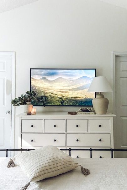 White Bedroom Tv Wall, Bed With Dressers On Each Side, Bedroom Dresser Under Tv Decor, Bedroom With Tv Stand, Styling Dresser With Tv, White Dresser In Living Room, White Dresser Decor With Tv, Bedroom Ideas With Tv On Dresser, Bedroom Tv Above Dresser