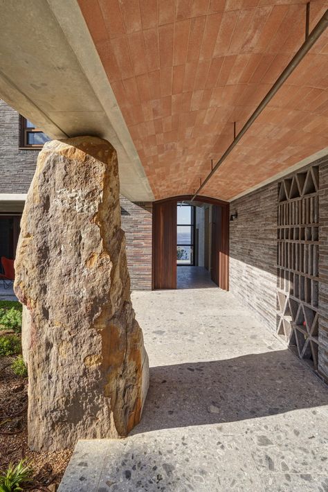 A highly crafted house pairs heavy natural materials such as stone and brass, with its impressive plot – a headland of of sandstone and shale jutting out into the Pacific Ocean Brown Architecture, Canyon House, Avalon Beach, Timber Ceiling, Concrete Stairs, New Architecture, Copper Roof, Red Brick House, Stone Columns