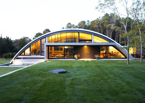 MB Architecture’s Stunning Energy-efficient Green Arc House is Mostly Buried Underground | 6sqft Hangar House, Hangar Home, Hangar Homes, Hanger House, House In The Hamptons, Quonset Homes, Quonset Hut Homes, Airplane Hangar, Earth Sheltered Homes