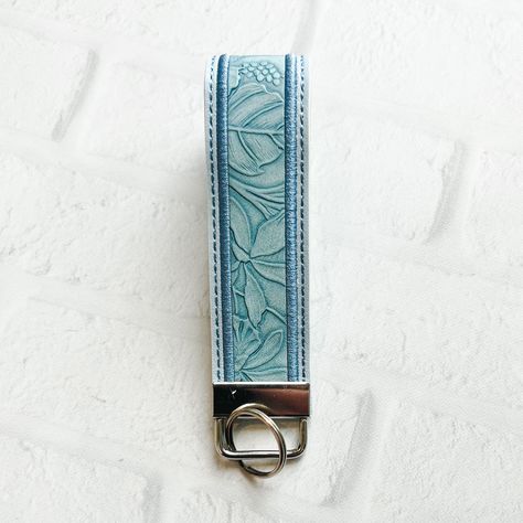 "Lt Blue Floral Embossed Vegan Leather Wristlet Keychain Key chain, Bridesmaid Gift Idea Gifts Under 20 For Her,Wristlet key fob, lanyard fob You are purchasing ONE wristlet keychain as shown in the photos above.  Designed with a combination of vegan leathers, this wristlet features an appliquéd center that can be monogrammed or personalized for an additional fee.   This wristlet is 5x1.25\" not counting the hardware.   Due to the nature of the different vinyls, pattern placement will vary.  No two are exactly alike.  These are handmade and the photos in the listing are examples of what you can expect but do not reflect the exact pattern placement.  I do have a no-return policy because of the customized nature of the items I sell.  However, if for any reason there is an issue with your ord Cute Keychains With Wallet, Wrist Keychain, Key Wristlet, Cute Key Wristlet, Keychain Wristlet, Leather Keychain Ideas, Key Chains Aesthetic, Cute Keychains For Car Keys, Car Keys Keychain Ideas