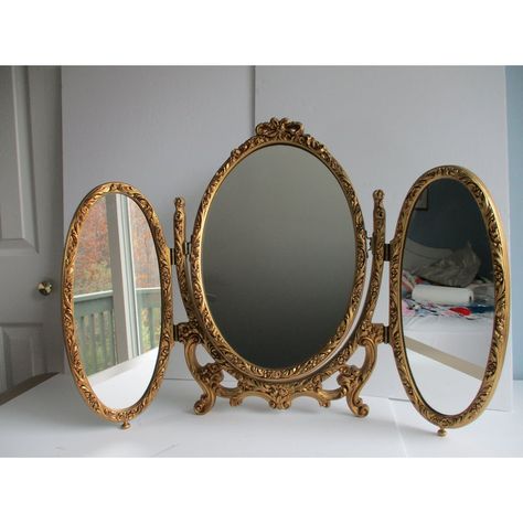 An Italian made, French Louis XVI style folding triptych table or vanity mirror.  This piece is made of metal and resin (plastic).  It features two folding oval side mirrors and a central mirror that can swivel upward or be completely removed from the mount; see pictures.  A fun and versatile mirror sure to please the eye.  This triptych mirror is in good vintage condition with some minor wear to the gilt paint on the body of the piece and a few minor specks on the mirrors themselves.  Please se 3 Mirrors, Headboard Mirror, Mirror Collection, Vintage Room Accessories, Table Mirrors, Vintage Victorian Furniture, French Chic Home Decor, Folding Mirror, 2 Vanities Side By Side