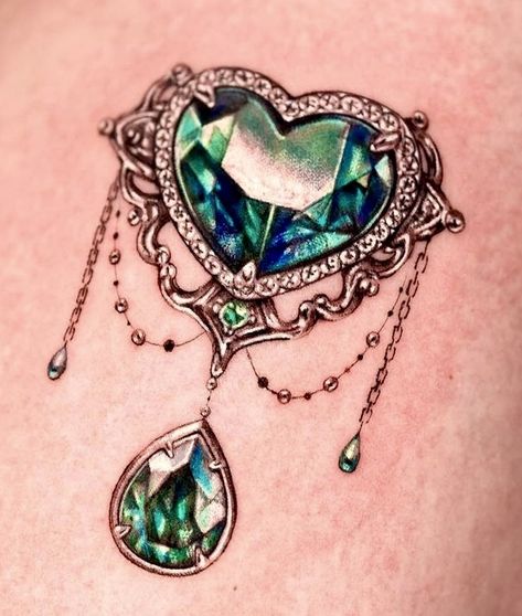 Green Jewel Tattoo, Jewel Tattoo Gem, Green Heart Tattoo, Bejeweled Tattoo, Jewel Chest Tattoo, Jewel Tattoos, Gemstone Tattoo, Metal Tattoos, Throat Tattoos