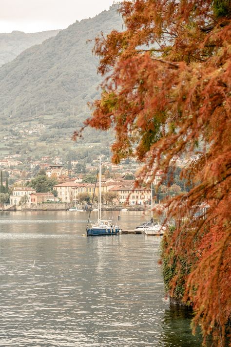 Escape to the breathtaking beauty of Lake Como in Italy during the enchanting autumn season. Immerse yourself in the warm tones and captivating atmosphere as you explore the charming streets and witness the stunning fall foliage. Don't miss the opportunity for a memorable travel photoshoot amidst this picturesque backdrop. Book now and make your Instagram feed come alive with the beauty of autumn in Italy!" Lake Como Autumn, Italy In Fall Aesthetic, Fall In Italy, Autumn In Italy, Italy In The Fall, Italian Autumn, Autumn Italy, Italy Fall, Italy In October