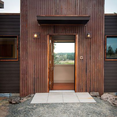 great example of corten siding paired with dark gray/matte black siding. Metal Siding House, Corrugated Metal Wall, Corrugated Metal Siding, Steel Siding, Corrugated Roofing, Backyard Canopy, Rustic Exterior, Contemporary Exterior, Metal Siding