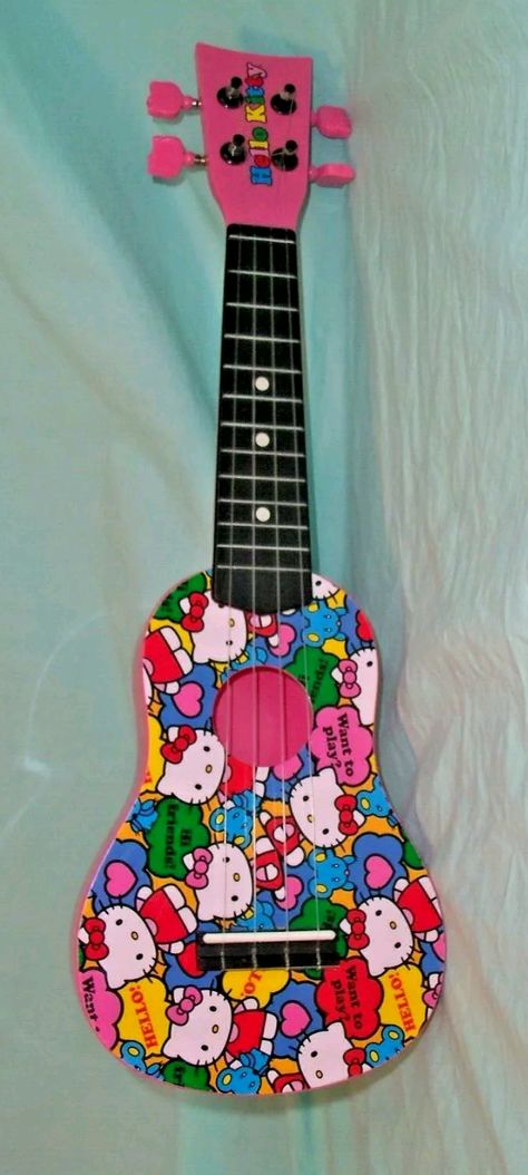 Hello Kitty plastic uke Hello Kitty Ukulele, Pyrography, Ukulele, Decoupage, Hello Kitty, Projects To Try, Kitty, Drawings, Music