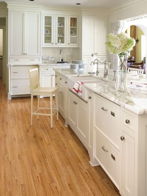 For a cozy yet modern kitchen, pair your light wood floors with white cabinets and stainless steel hardware to make the natural wood grain a focal point in ... Engineered Bamboo Flooring, White Wood Kitchens, Wood Floor Kitchen, Light Hardwood, Light Hardwood Floors, Light Wood Floors, Wood Laminate Flooring, Wood Kitchen Cabinets, Oak Kitchen