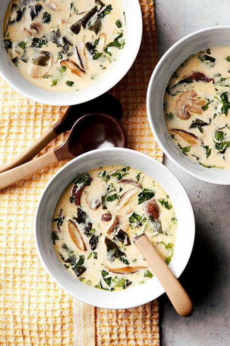 Shiitake mushrooms provide the perfect savory umami flavor in dishes when meat isn't on the menu. This Asian-inspired vegan soup recipe combines fresh mushrooms with coconut milk and wakame (seaweed) for the ultimate meaty, seafood-like flavor with no meat or dairy involved. #vegetariansoup #vegetarianrecipes #coconutmushroomsoup #bhg Mushroom Spinach Soup Recipes, Mushroom And Spinach Soup, Mushroom Spinach Soup, Pizza Noodles, Holiday Soup Recipes, Colorado Recipes, Creamy Spinach Soup, Creamy Turkey Soup, Holiday Soups