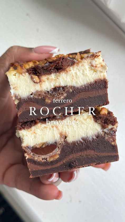 Ferrero Rocher Cheesecake Brownies – a divine fusion of fudgy brownies, velvety cheesecake, and the irresistible charm of crunchy Ferrero… | Instagram Chocolate Bar Brownies, Desert Bar Ideas, Showstopping Desserts, Ferrero Rocher Dessert, Ferrero Rocher Brownies, Birthday Dessert Ideas, Christmas Desserts Ideas, Dipped Cheesecake, Candy Brownies