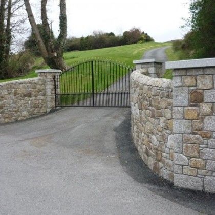 Stone Entrance Walls and Driveways enhance and define your property. Peter Fitzpatrick can add classic beauty to any driveway. We offer a wide variety of entrance styles to suit your desired stone… Entrance Walls, Stone Entrance, Entrance Gates Driveway, Brick Wall Gardens, Building A Stone Wall, Property Gates, Driveway Entrance Landscaping, Stone Driveway, Driveway Entrance