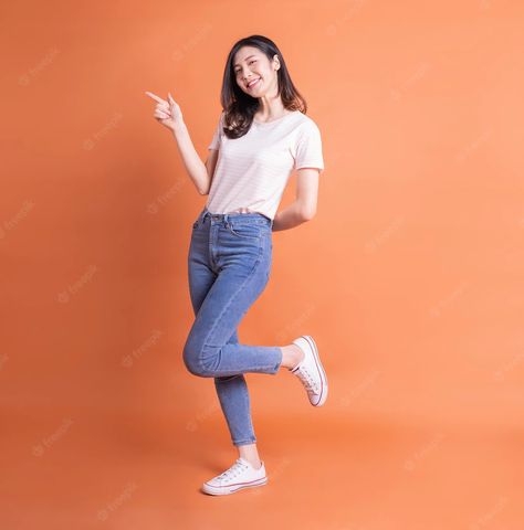 Premium Photo | Full length image of young asian woman posing on orange background Full Photo Poses, Rak Makeup, Corporate Shoot, Collage People, Kapten Marvel, Commercial Model, Dessert Photography, Woman Posing, Standing Poses