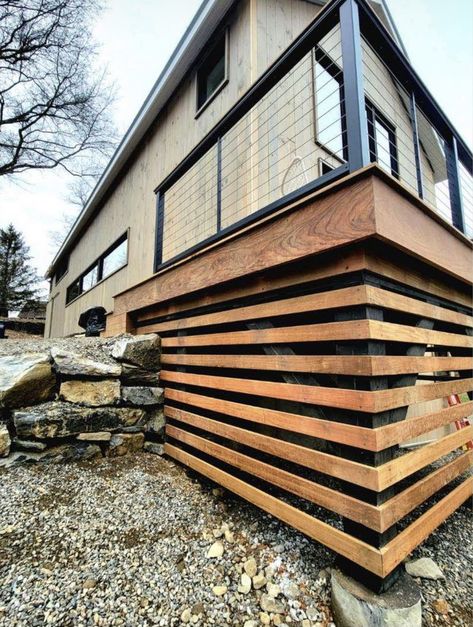 Wood Slats Under Deck, Daylight Basement Exterior, Lakefront Deck Ideas, Horizontal Deck Skirting Ideas, Corner Deck Ideas, Wood Underpinning, Deck Facia, Lattice Alternative, Cantilever Deck