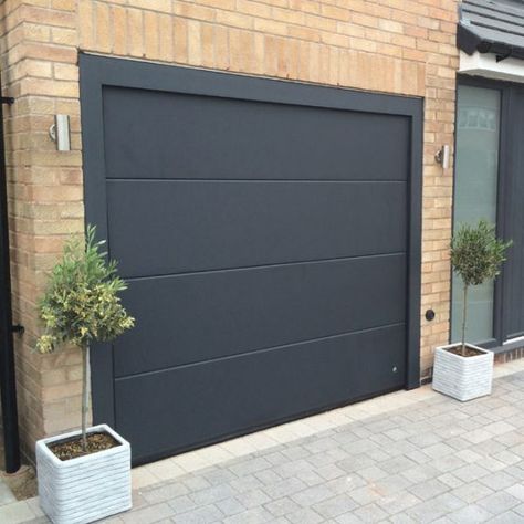 Black Garage Door, Black Garage Doors, Metal Garage Doors, Black Garage, Sectional Garage Doors, Modern Garage Doors, Garage Door Types, Garage Door Styles, Wood Garage Doors