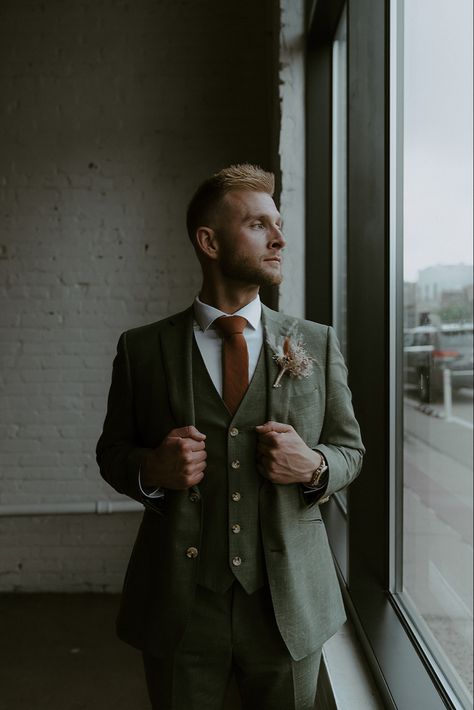 Green Suit Terracotta Tie, Green And Burgundy Groomsmen Attire, Olive Green Tie Outfit Men, Indochino Suit Wedding, Green Suit Orange Tie, Earthy Suits For Men, Green Suit Brown Tie, Dark Green Tweed Wedding Suit, Dark Green Tweed Suit