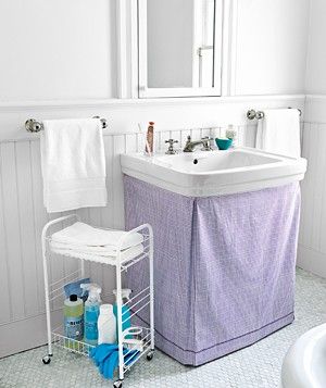 By minimizing the mess and maximizing the storage, you’ll create a cool, calm space where you can feel collected. Pedestal Sink Cover, Sink Skirt, Bathroom Storage Hacks, Sink Cover, Decorating Bathroom, Sink Storage, Small Bathroom Storage, Pedestal Sink, Creative Storage