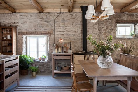 An Antique Stone House Revived, from John and Juli Baker of Mjolk in Toronto - Remodelista Stone House Interior, Juli Baker, Ercol Chair, Marble Tub, Fireplace Tile Surround, Vintage Light Fixtures, Rustic Kitchen Design, Antique Stone, Rustic Kitchen Decor