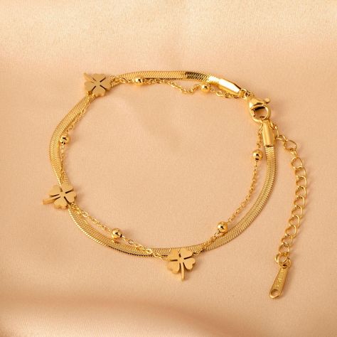 Product name: Non-fading double layer Four-leaf clover flat snake bone bracelet Material: Titanium steel Size: chain length 180+50mm Packaging: gift box Color: gold Product weight: 3.43g Remarks Statement: We use vacuum furnace electroplating for color plating, and the material is also selected 316 titanium steel, no discoloration, no rust, no allergy, no black, wear-resistant, green and environmental protection Gold Design Bracelet, Double Chain Bracelet Gold, Gold Leaf Bracelet, Breslet Jewelry Gold, Gold Breslet, Bracelet Ideas Gold, Gold Bracelet Design, Good Bracelet, Real Gold Bracelet