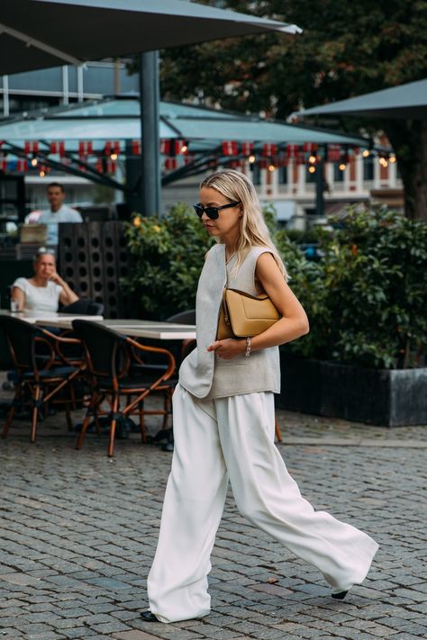 The Best Street Style at the Spring 2022 Copenhagen Fashion Shows | Vogue Street Style Chic Summer, Spring Summer Style 2023, High Fashion 2022, Copenhagen Street Style Summer, Minimal Fashion Summer, Copenhagen Fashion Week Street Style, Copenhagen Street Style, Trousers White, Reportage Photography