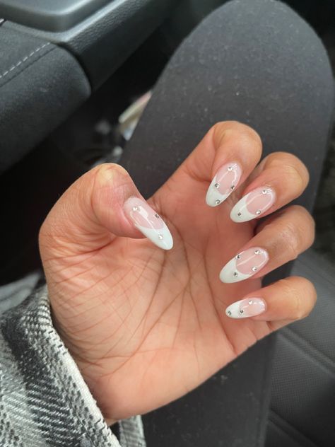 Almond French tip nails, birthday nails, gem stones on the nail, jewls on the French tip French Mani With Gems, French Tip Nails With Stones, French Tip With Gems Nails, Almond French Tips With Gems, Almond French With Gems, Prom Nails Gems, Gem Nails French Tip, French Tip Gems Nails, Cute Almond French Tip Nails