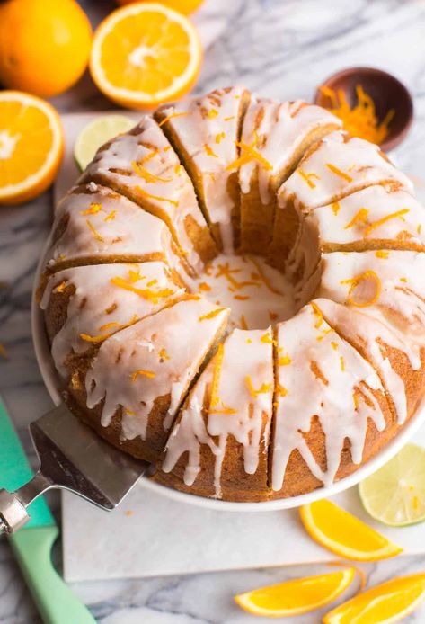 This Boozy Orange Drizzle Cake is bright, zesty and bursting with flavour! The cake is moist and tender, brushed with a boozy simple-syrup to lock in moisture and flavour and then finished off with an orange-y icing glaze. Make sure to check out the recipe notes for how to make this cake in loaf pan instead! | Gluten Free + Dairy Free Option Cake In Loaf Pan, Orange Drizzle Cake, Icing Glaze, Citrus Desserts, White Desserts, Glaze For Cake, Lemon Poppyseed Muffins, Drizzle Cake, Boozy Desserts