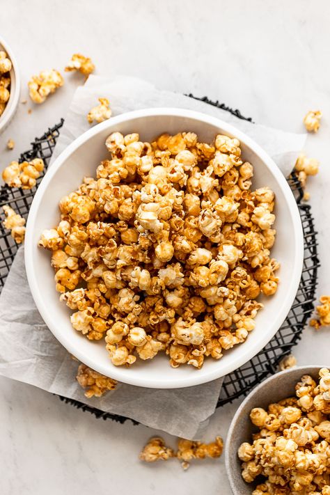 When you need a sweet, salty, crunchy snack that everyone loves - homemade caramel popcorn is the answer! It's easy to make with a rich caramel flavor that's full of depth - plus a little saltiness for the perfect balance. It's a snack you won't be able to stop snackin', whether it's movie night or not. Make Caramel Popcorn, Microwave Caramel Corn, Chocolate Drizzled Popcorn, Homemade Caramel Popcorn, Caramel Popcorn Recipe, Popcorn Recipes Caramel, Salty Popcorn, Leftover Candy, Popcorn Treats