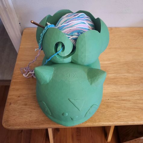 Say hello to BOWLbasaur! This is a yarn bowl that I designed for my partner to use for crochet. Her favorite Pokémon is Bulbasaur 🌺. Who's yours? Find more of our 3D printing journey on our etsy! Shop.rood.network #bulbasaur #pokemon #yarn #yarnaddict #yarnlove #crochet #crochetaddict #craft #crafty #crochetersofinstagram #3dprinting #3dprint #3dprintgifts 3d Print Yarn Bowl, 3d Printing Crochet, 3d Printed Crochet Tools, Bulbasaur Pokemon, 3d Printing Art, Crochet Tools, Print Ideas, Yarn Bowl, My Partner