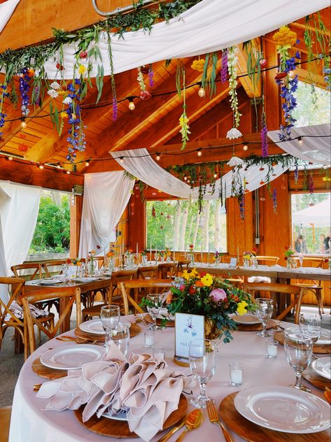 Wedding Reception, Nature wedding, outside wedding, mountain wedding Indoor Wildflower Wedding, Indie Wedding Decor, Wildflower Rustic Wedding Theme, Eclectic Wildflower Wedding, Country Mountain Wedding, Fall Wildflower Wedding Decor, 70s Wildflower Wedding, Vibrant Boho Wedding, Whimsical Wedding Indoor