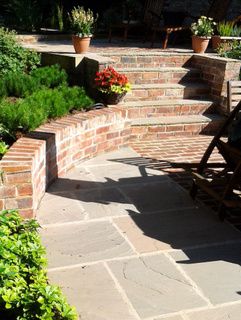 Brick garden steps at a garden in Leeds Brick Landscape, Curved Patio, Garden Patios, Backyard Layout, Patio Layout, Patio Steps, Sandstone Paving, Stone Steps, Brick Garden