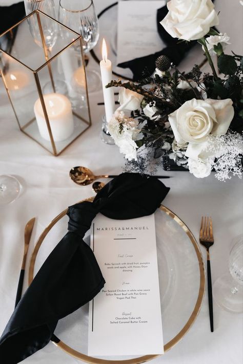 Black Napkin Wedding Place Settings, Black White Gold Tablescape, Black Tie Wedding Theme Color Schemes, Black White And Gold Table Decorations, Black Chargers Table Settings, Black And Gold Place Setting, Black And Silver Tablescape, Black Napkins Wedding Place Settings, Black Napkin Table Setting