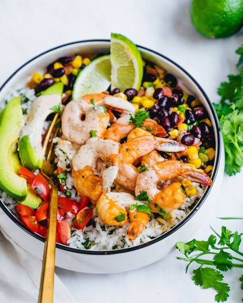 Shrimp Bowl with Cilantro Lime Rice – A Couple Cooks Shrimp Bowl Recipe, Cilantro Corn, Broiled Shrimp, Shrimp Bowl, Rice Black Beans, Chipotle Ranch Dressing, Shrimp Taco, A Couple Cooks, Chipotle Ranch