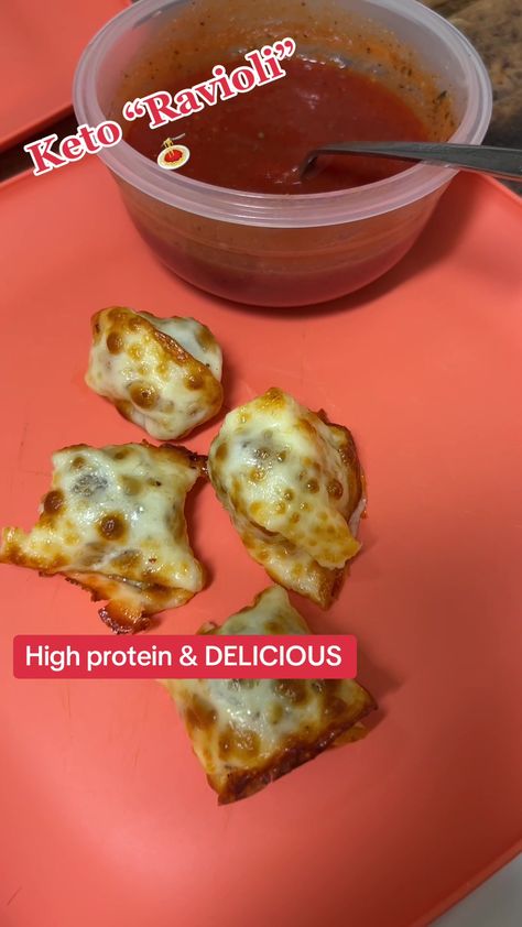 Craving ravioli but following a keto diet? You'll love this cheesy and high protein twist! Using provolone cheese as a base, these ravioli are filled with delicious meatballs or a cheese mixture. They're cooked in an air fryer for a crispy texture. Get the recipe and give them a taste! #KetoRavioli #HighProteinMeal #LowCarbRecipe #DeliciousAndHealthy Meatball Ravioli, Keto Ravioli, Cheese Ravioli Recipe, Protein Bread Recipes, Protein Cookie Recipes, High Protein Keto, Delicious Meatballs, The Ultimate Keto Meal Plan, Ultimate Keto Meal Plan