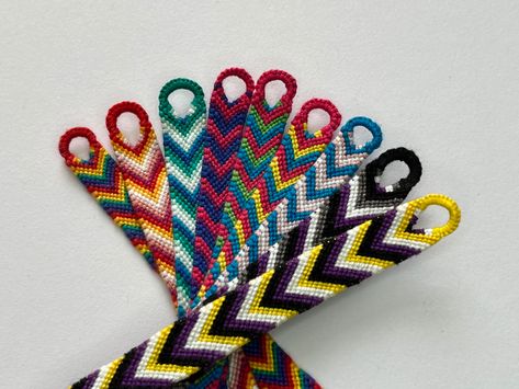 Picture of bracelets with LGBT Pride flag colors depicting LGBT flag, non-binary, asexual, transgender, pansexual, polysexual, bisexual, gay and lesbian flags Pride Embroidery Bracelets, Pride Friendship Bracelet, Embroidery Thread Bracelets, Lgbt Bracelet, Bracelet Stuff, Flag Bracelet, Bi Flag, Diy Friendship Bracelets Tutorial, Bracelets Tutorial