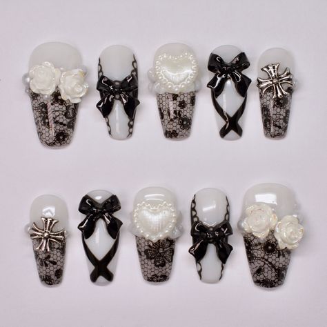 Gothic Bride ~Made to order~ Medium coffin nails, black lace, white ruffle sculpting, charms, nail art. Shop nails: celixxunails.com TikTok: Celixxu.nails Yt: CelixxuNails #nailartist #nailtech #beginnernailtech #beginnernailartist #pinterestnails #koreannailstyle #japanesenailart #y2knails #coquettenails #xiaohongshunails #gelxnails #pressonnails #douyinnails #smallbusiness #smallbusinessowners #nail #nails #nailart #naildesign #gelnails #gelpolish #gelnail #chromenails #auranails Coffin Nails Black, Medium Coffin Nails, White Lace Nails, Lace Nail Art, Gothic Bride, Medium Coffin, Punk Nails, Lace Nails, Gothic Nails