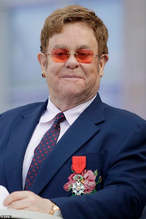 Elton John Iconic Outfits, Sir Elton John, Elton John Photography, Elton John Iconic Looks, Elton John Photos, Elton John Heart Glasses, Elton John Iconic Photos, The Accolade, David Furnish