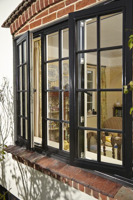 Black timber window featuring traditional cottage bars Box Window Curtains Ideas, Casement Windows Exterior, Paneled Windows, Rustic Windows, Windows Farmhouse, Wooden Casement Windows, Aluminum Windows Design, Circular Windows, Windowsill Decor