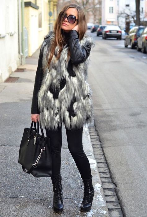 facf9f743b083008a894eee7baa16469desc43704739ri Fur Vest Over Leather Jacket, Faux Fur Vests Outfits, Fur Vest Outfits, Fall Leather Jacket, Fall Travel Outfit, Fur Vests, Sassy Women, Long Vest, Winter Leggings