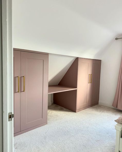 IKEA PAX Customisation | Maximizing every nook and cranny with style! Our IKEA PAX fitted wardrobe with dusky pink custom doors fits perfectly under the eaves. ✨ … | Instagram Wardrobe Nook Ideas, Loft Eaves Wardrobe, Dormer Built In Wardrobe, Storage Attic Ideas, Dormer Wardrobe, Eves Wardrobe Ideas, Bedroom Eaves Ideas, Under Eaves Storage Sliding Doors, Attic Wardrobe Ideas Sloped Ceiling Built Ins