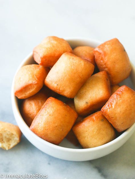 Jump to Recipe Print Recipe     Soft Mini Mandzi – East African Doughnuts made with grated coconut,  spiced with cardamon, nutmeg and fried to perfection. So I guess  it is no secret that I love fried dough, you can tell by all puff-puffs, and doughnuts that I have featured here on this blog. Not to talk … Mandazi Recipe Kenya, Mandazi Recipe, Ugandan Food, African Snacks, Chapati Recipes, Kenyan Food, African Dessert, Africa Food, African Cooking