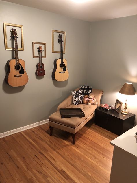 Guitars Mounted On Wall, Mount Guitars On Wall, Wall With Guitars, Instruments Hung On Wall, Bedroom With Guitar On Wall, Guitar Wall Mount Aesthetic, Guitar Wall Decoration, Guitar As Decor, How To Display Guitars