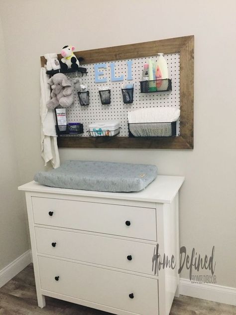 Want to add functional wall art to a nursery? Learn how to make an easy DIY nursery pegboard changing station that is functional yet adorable.  When we moved to Florida, we thought we had planned out the first year very carefully. We did not include getting pregnant on our agenda. Since life works in mysterious ways, we got pregnant 2 weeks after our move. To make a long story short, we needed to make room for our little one and a DIY Nursery Pegboard Changing Station seemed like… Peg Board Nursery Ideas, Pegboard Nursery, Diy Nursery Furniture, Hanging Bassinet, Tiny Entryway, Diaper Station, Cowboy Room, Basket Makeover, Functional Wall Art