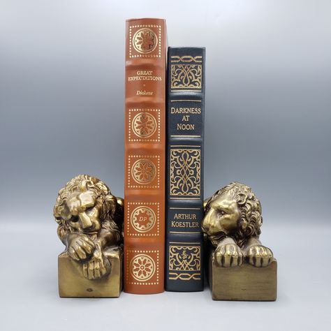 We sold 50 books last week, now you need some bookends to hold them up! We have a few pair of vintage bookends in this week's Curated Consignment sale. This pair of lion bookends are my favorite. Available at 8pm Wednesday evening in our online store. $60 including complimentary local delivery. www.ShopSBH.com Dark Academia Study, Lion Bookends, Lion Book, Vintage Bookends, Gold Book, Vintage Housewares, Baboon, Formal Dining Room, Eclectic Decor