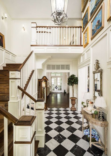 Traditional style entry and staircase in a classic house by The Fox Group. Black and white check floor, white trim, and warm wood on stairs. #traditionaldesign #classicdecor #entry #staircase #housedesign #interiordesigninspiration White Foyer, Entryway Tile, Custom Home Plans, Timeless Interiors, Entry Ways, Black And White Tiles, Hello Lovely, Black And White Marble, White Floors