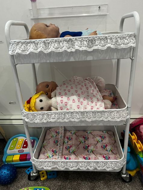 Babydoll Storage, Diy Baby Doll Furniture, Baby Doll Storage, Baby Doll Storage Ideas, Baby Doll Area In Playroom, Doll Clothes Storage Hack, Rolling Cart Organization Baby, Underbed Doll Storage, Baby Doll Nursery Playroom Ideas