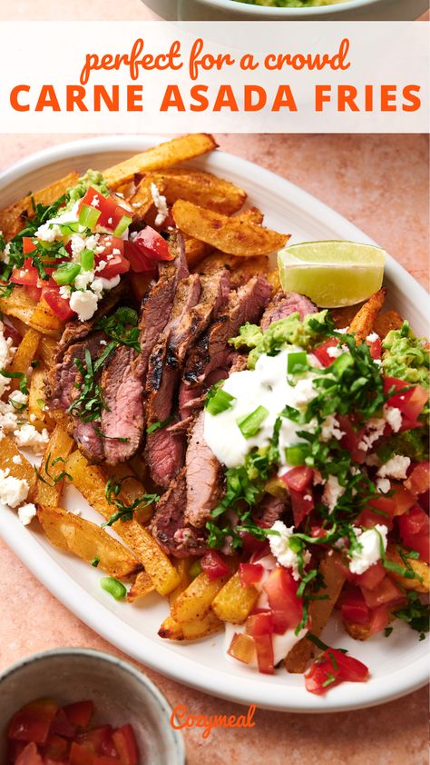 Get ready to dive into a culinary fiesta with these carna asada fries. A mountain of oven baked Mexican fries is heaped with juicy carne asada with creamy guacamole and a medley of fresh toppings, perfect for feeding a crowd. Air Fryer Goat Cheese, Carne Asada Fries Recipe, Goat Cheese Balls, Oven Baked French Fries, Carne Asada Fries, Healthy Mexican Recipes, Healthy Mexican, Fries Recipe, Juicy Steak