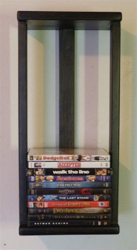 Dvd Wall Storage, Dvd Wall, Dvd Storage Ideas, Movie Storage, Diy Dvd Storage, Diy Dvd, Video Game Storage, Dvd Shelves, Cd Dvd Storage