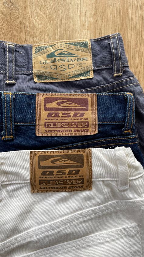 a dark purple, a blue, and a white pair of vintage billabong jeans laid over top of one another showing their large leather tabs tooled with vintage quiksilver branding Little Top Big Pants, Vintage Surf Style, Vintage Corduroy Pants, Vintage Surfwear, Faded Blue Jeans, Vintage Quiksilver, Nyc Lifestyle, Vintage Corduroy, Vintage Surf