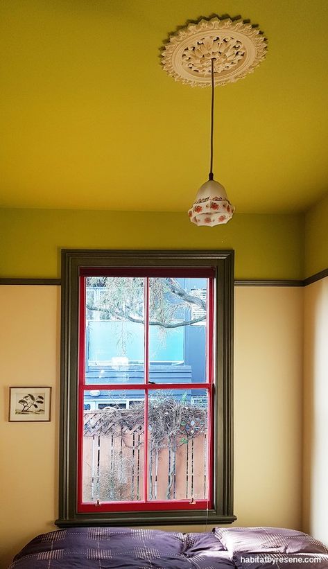 This bedroom is painted in Resene Billy T above the picture rail, with Resene Astra below. The windows are in Resene Shiraz (red) and Resene Vault metallic. #interiordesign #interiorinspiration #interiorideas #bedroominspiration #bedroomideas #bedroomdesign #greenbedroom #greenfeaturewall #colourcombos #colourpalette #resene #greenceiling #ceilinginspiration #ceilingideas Picture Rail Low Ceiling, Picture Rails Bedroom, Picture Rail Bedroom Ideas, Paint Above Picture Rail, Painted Picture Rail, Picture Rail Paint Ideas, Picture Rail Living Room, Picture Rail Bedroom, Bristol Houses