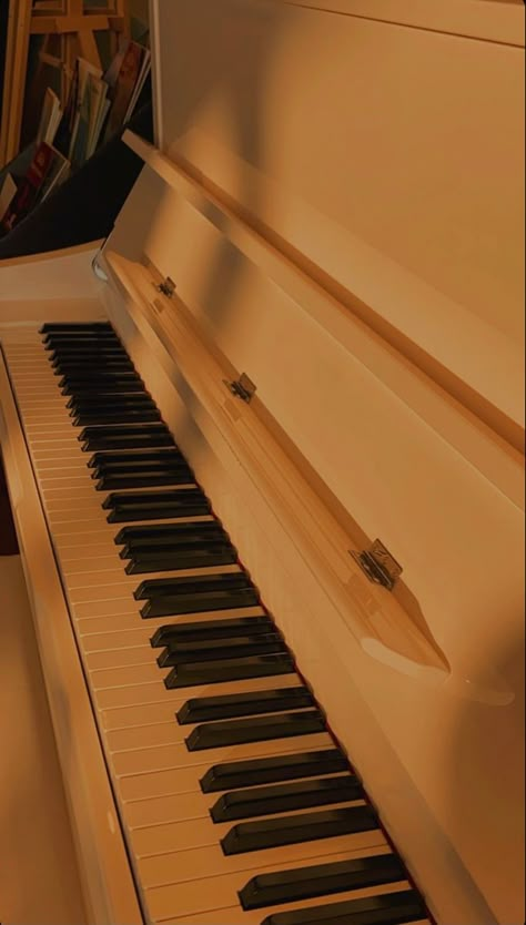 a yamaha piano, with a golden lightning, kind of aesthetic Beige Piano Aesthetic, Yellow Piano Aesthetic, Piano Brown Aesthetic, Orange Piano Aesthetic, Piano Aesthetic Wallpaper, Orange Piano, Golden Hour Piano, Aesthetic Piano, Piano Wallpaper